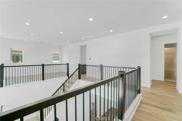 an empty room with a window and a mirror