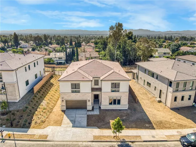a aerial view of a house with a yard