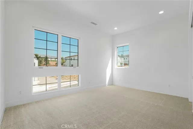 a view of staircase with lots of wooden floor and windows