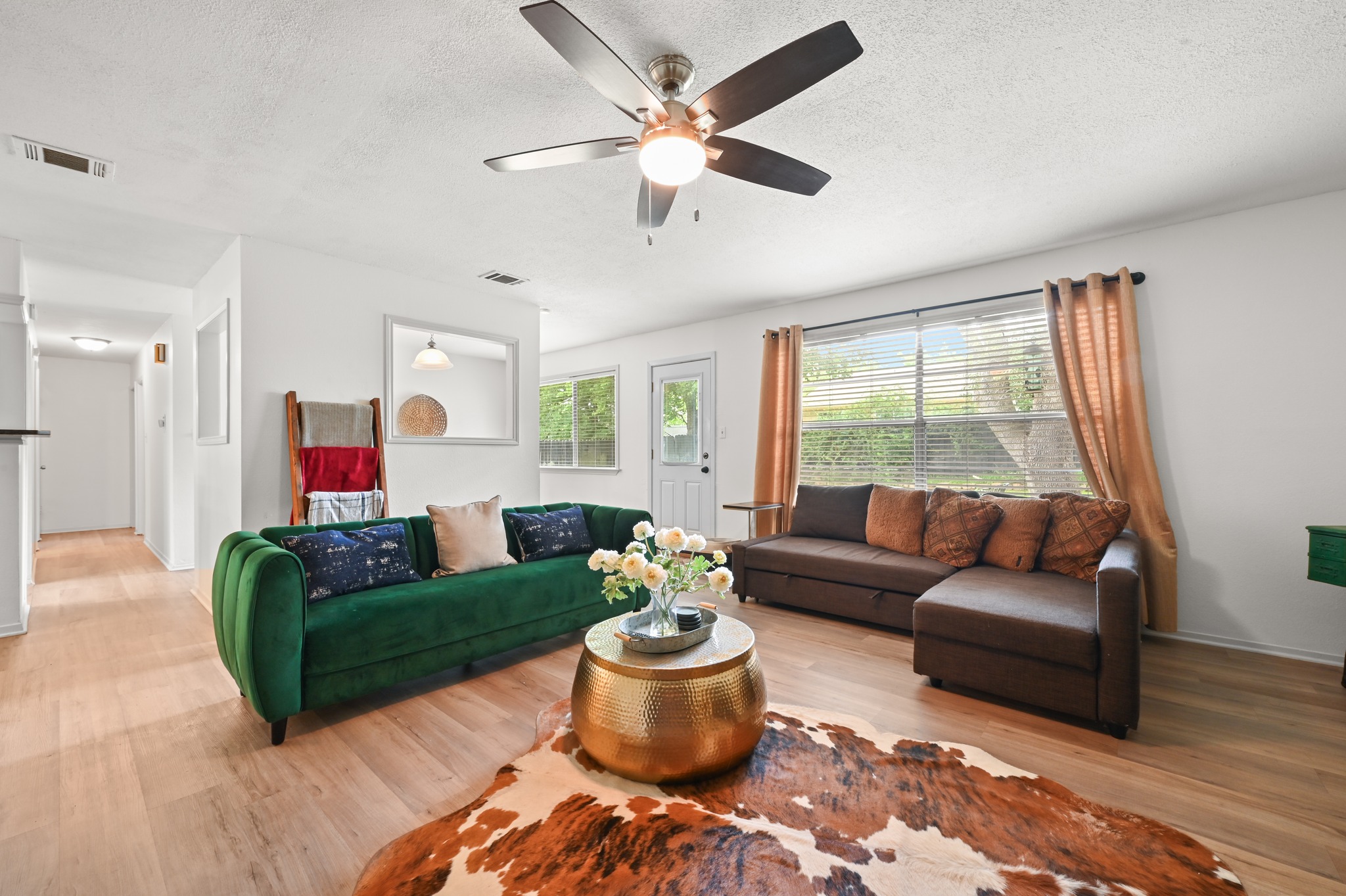 6805 Rearden Road Austin, TX 78745 - Photo 4 of 26 Sun-filled living space with light-toned flooring and abundant natural light.