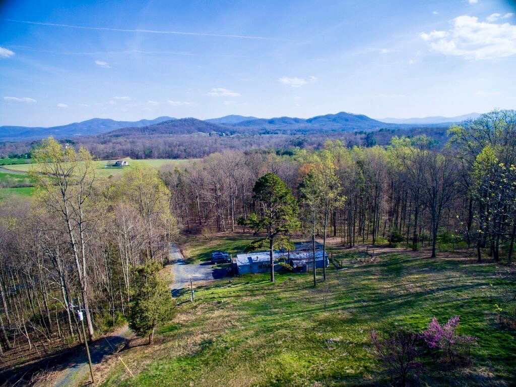 8907 Dick Woods Road Afton, VA 22920 - Photo 1 of 19 a view of a chairs in a backyard