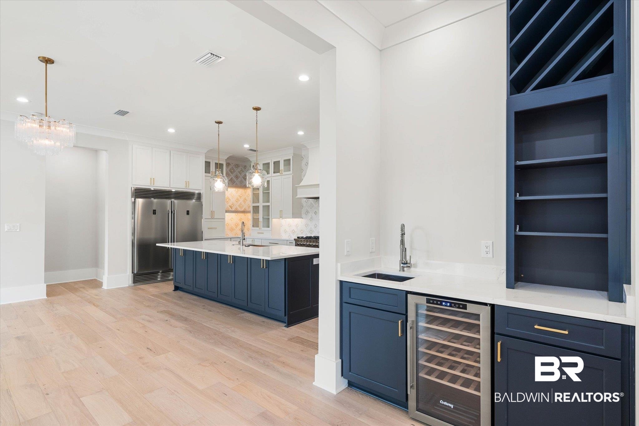 853 Inlet Circle Gulf Shores, AL 36542 - Photo 5 of 55 Bar featuring a sink, beverage cooler, backsplash, built in refrigerator, and visible vents