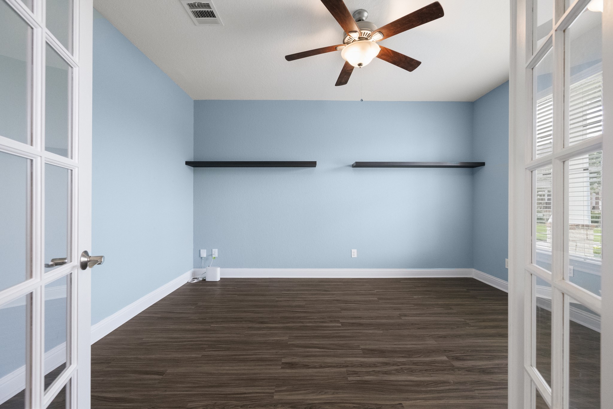 7502 Windsor Park Court Spring, TX 77379 - Photo 6 of 50 wooden floor in an empty room with a window