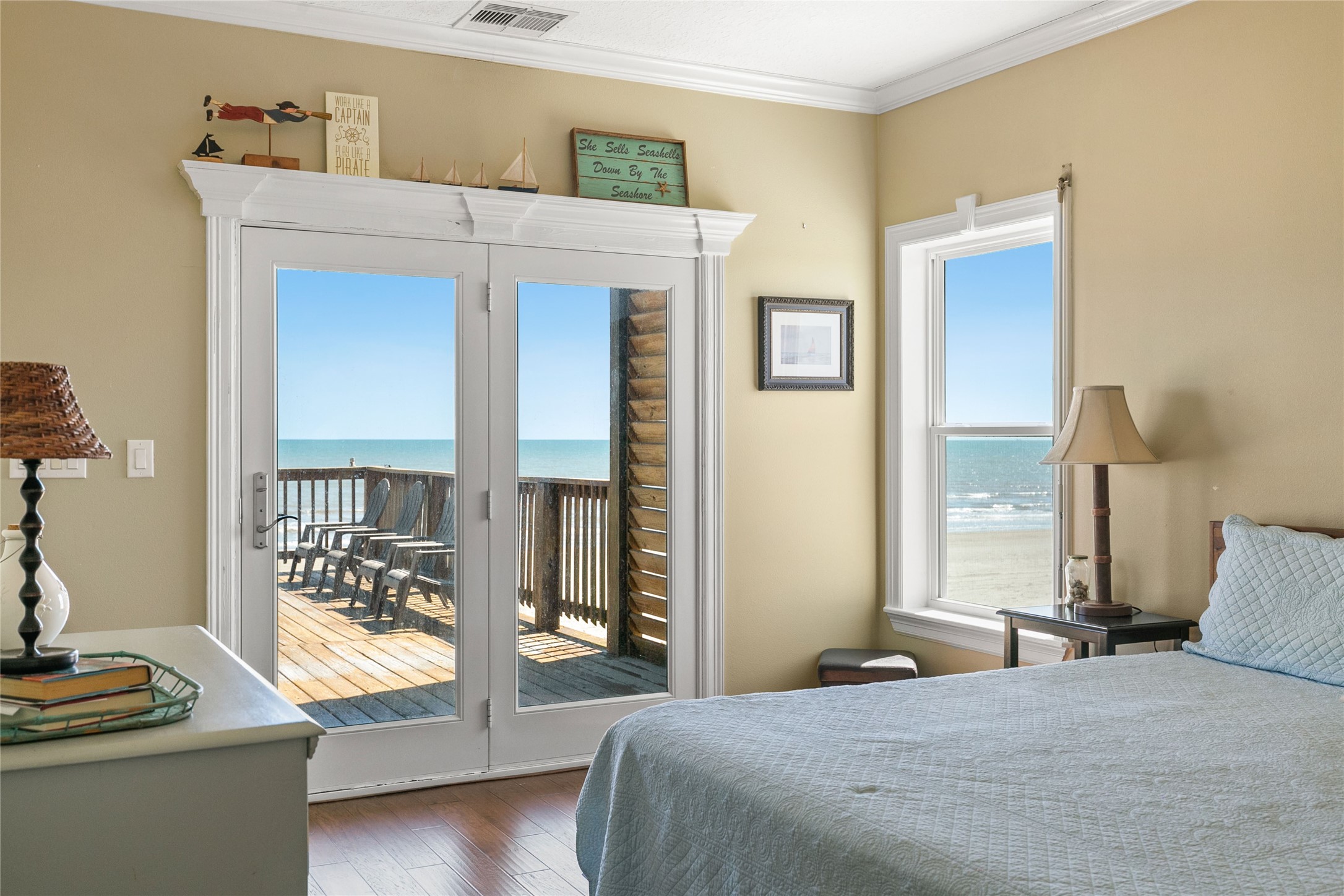 10530 Bluewater Highway Freeport, TX 77541 - Photo 19 of 43 a bedroom with a bed and glass window