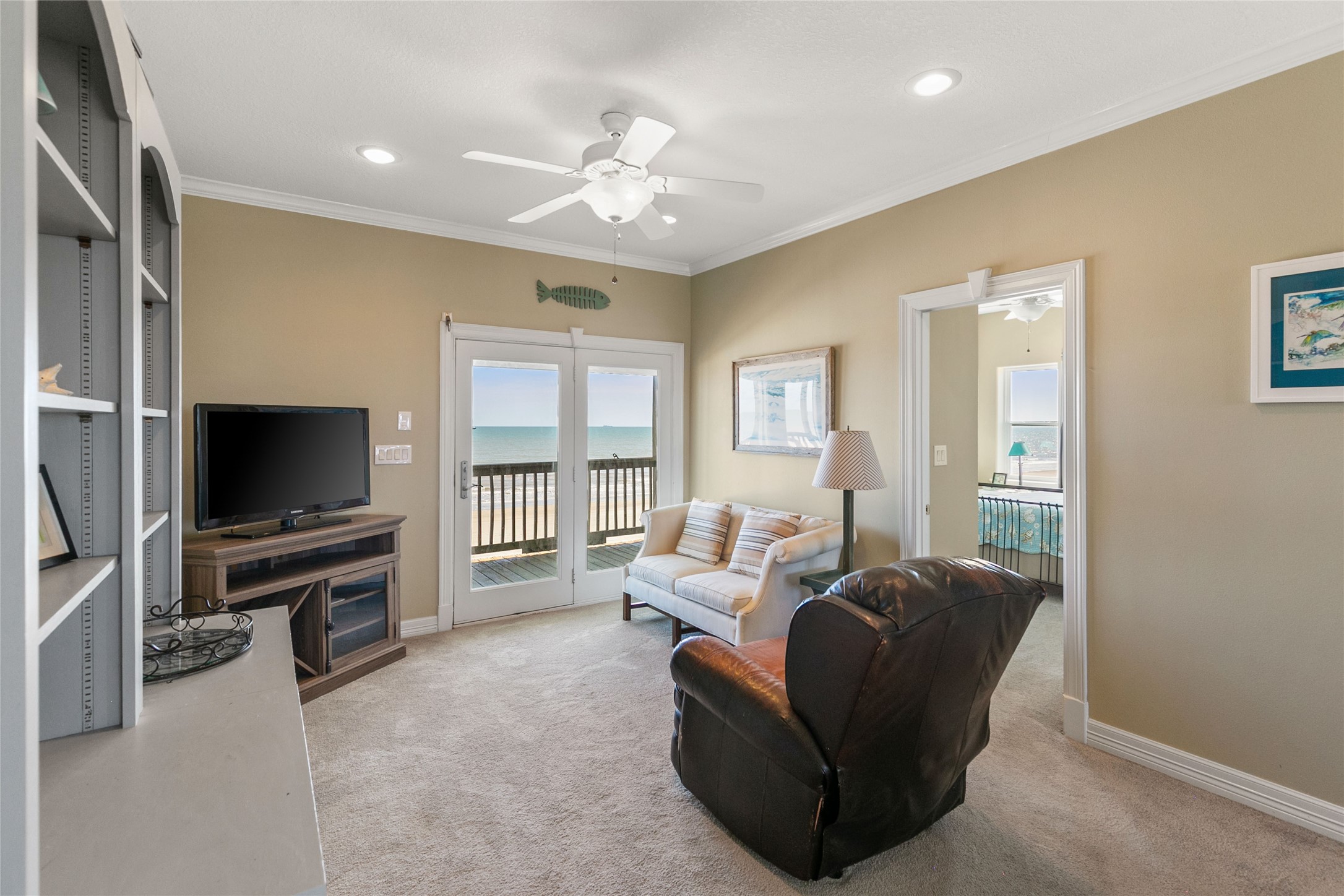 10530 Bluewater Highway Freeport, TX 77541 - Photo 27 of 43 a living room with furniture and a flat screen tv