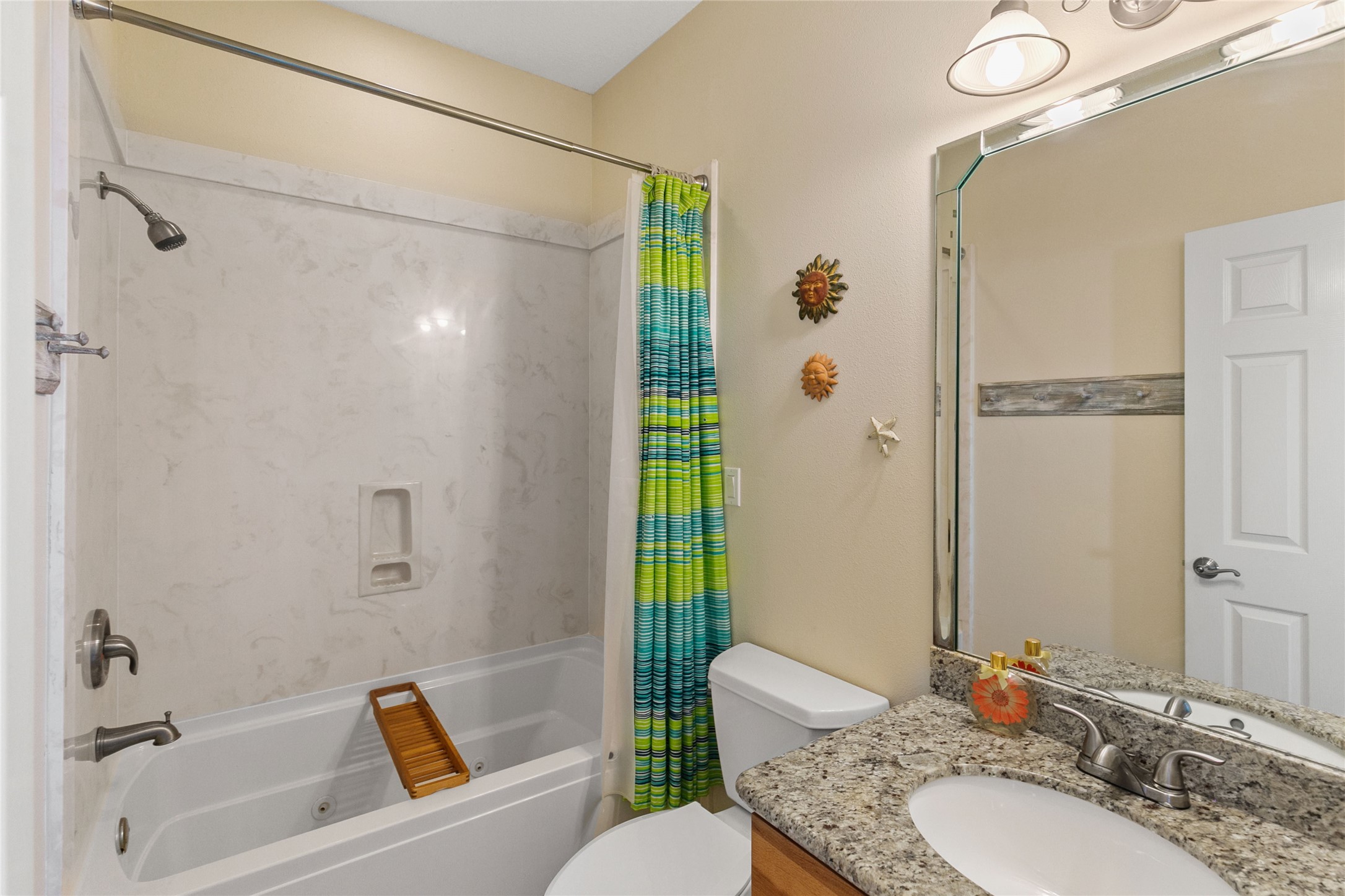 10530 Bluewater Highway Freeport, TX 77541 - Photo 36 of 43 a bathroom with a granite countertop sink mirror toilet and shower