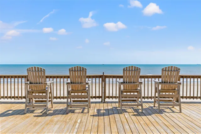 a view of a balcony with wooden floor