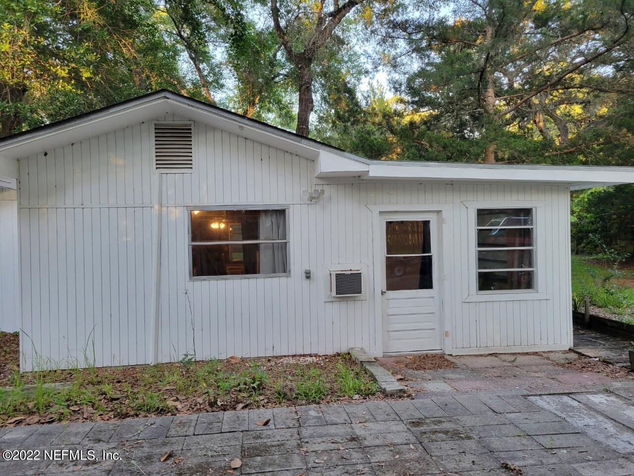 25035 Northeast 131st Place Salt Springs, FL 32134 - Photo 2 of 21 a front view of a house with garden