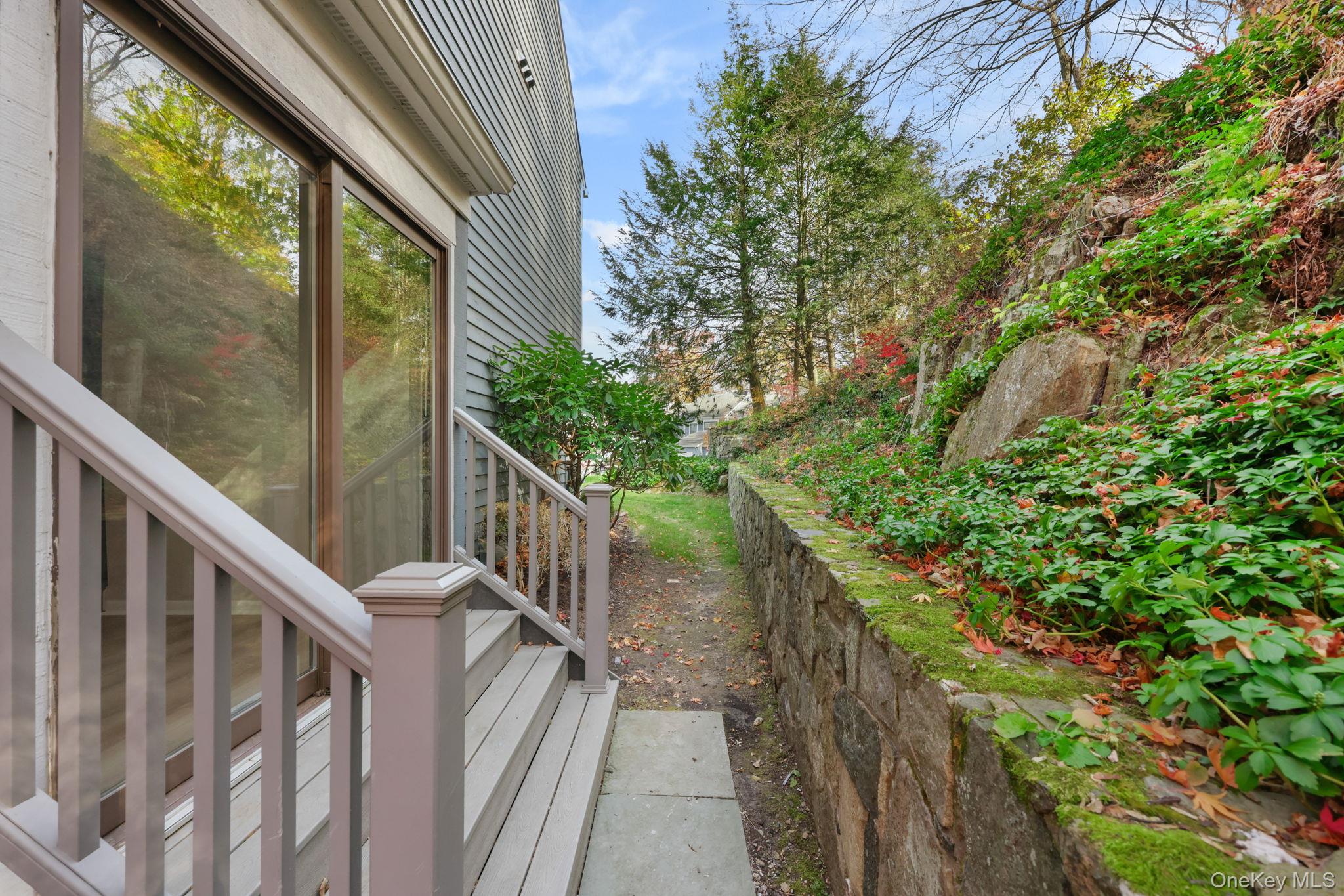 42 Timber Ridge Mount Kisco, NY 10549 - Photo 8 of 39 Sliding Glass Doors from Dining Room lead to a private area