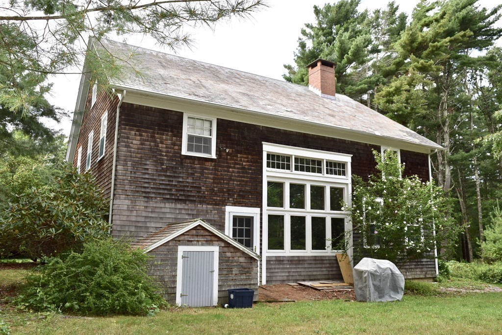 498 A Point Road Marion, MA 02738 - Photo 9 of 12 a front view of a house with a garden