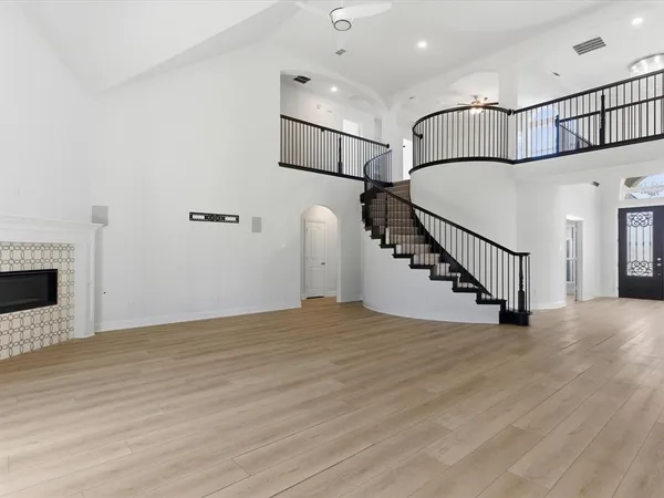 a view of an entryway with wooden floor
