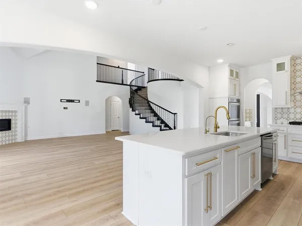 a kitchen with a sink and cabinets