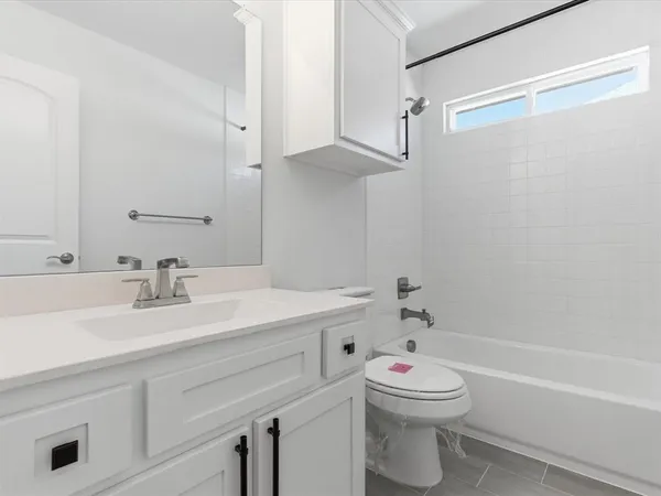 a bathroom with a sink a toilet and a bathtub