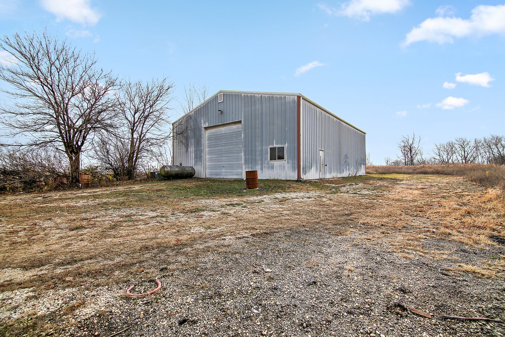 1745 4100N Road Herscher, IL 60941 - Photo 19 of 31 a view of an house with backyard and trees