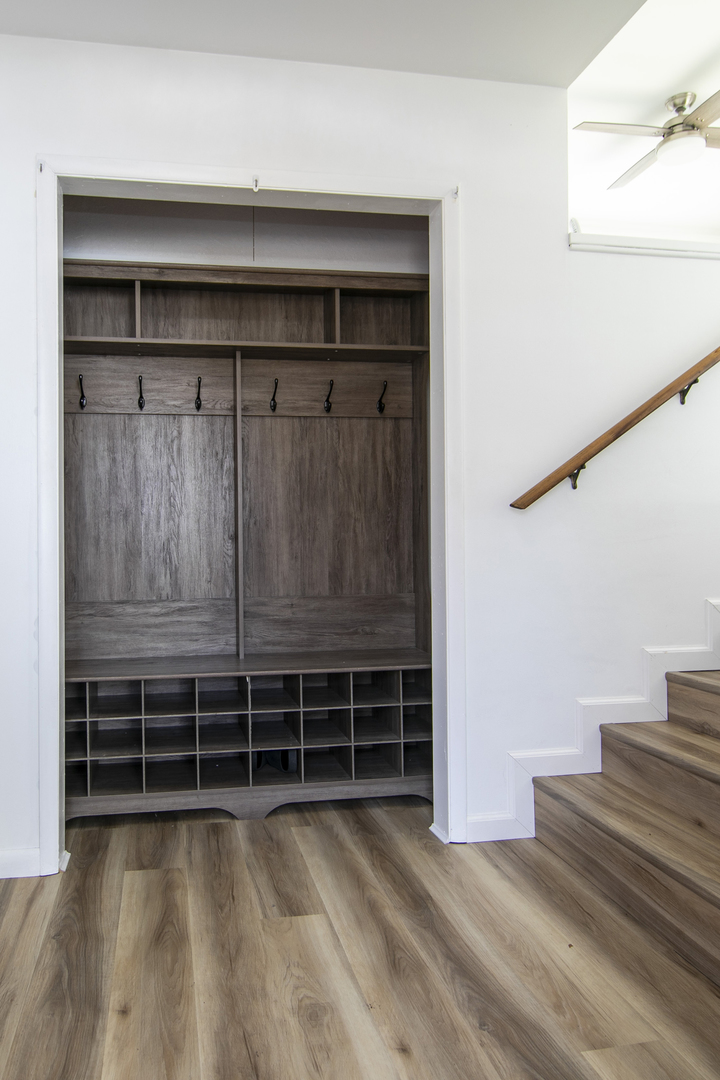 1745 4100N Road Herscher, IL 60941 - Photo 3 of 31 a view of an empty room with wooden floor and stairs