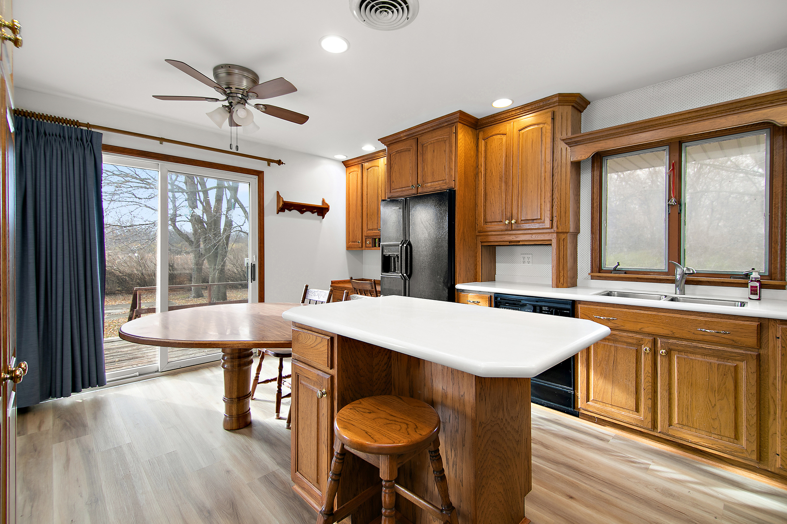1745 4100N Road Herscher, IL 60941 - Photo 6 of 31 a kitchen with a table chairs sink and wooden floor