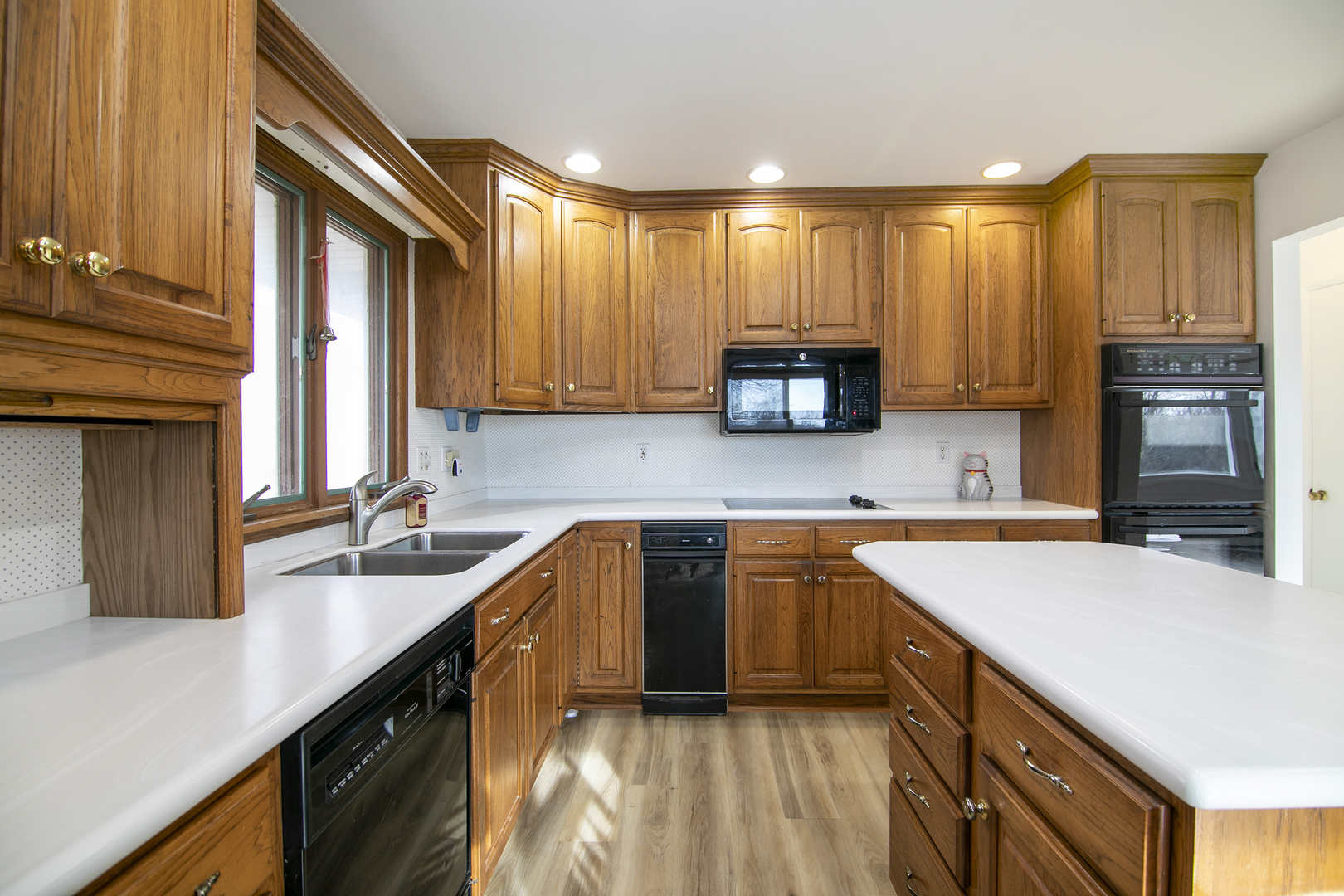 1745 4100N Road Herscher, IL 60941 - Photo 7 of 31 a kitchen with a sink stove top oven and cabinets