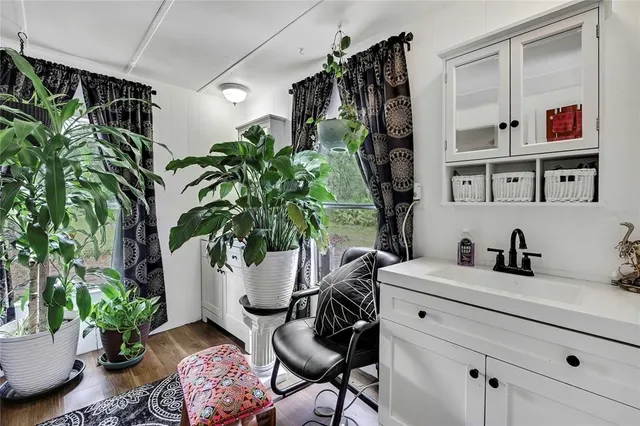 a vase of flowers sitting on a table in a living room