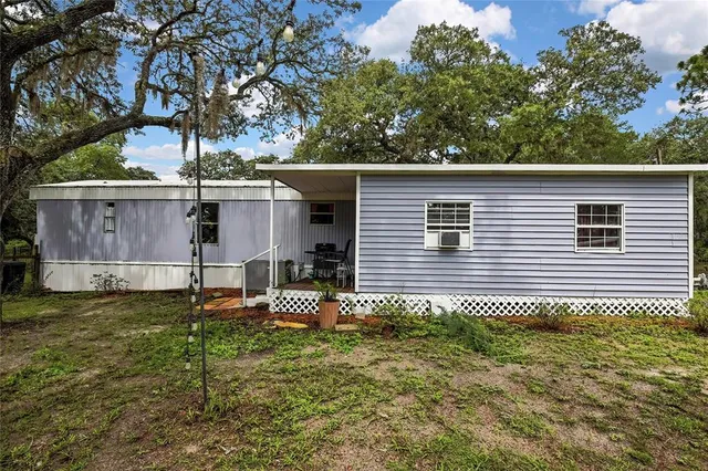 a backyard of a house with garden