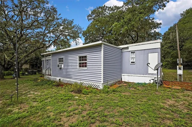 a backyard of a house with lots of green space