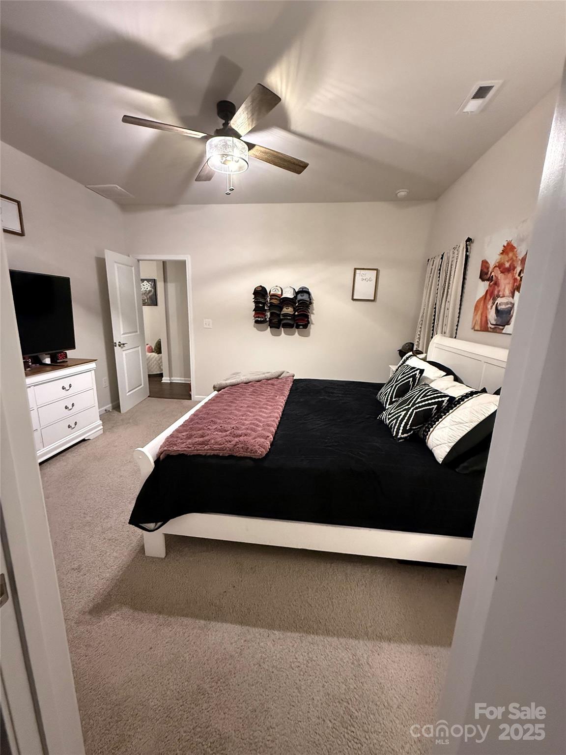 115 Stoney Lane Cherryville, NC 28021 - Photo 27 of 27 a bedroom with a bed window and a flat screen tv