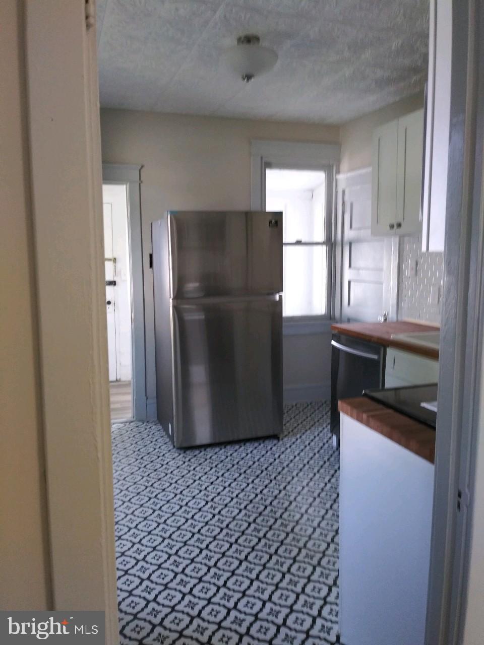 807 Merlin Street Bristol, PA 19007 - Photo 5 of 18 a kitchen with a refrigerator and a sink