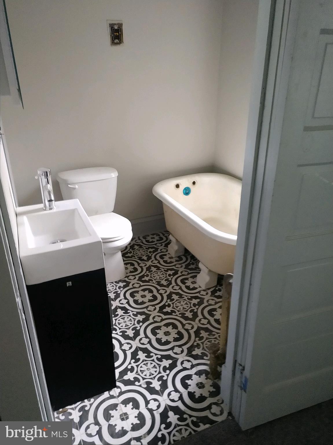 807 Merlin Street Bristol, PA 19007 - Photo 9 of 18 a bathroom with a sink toilet and a mirror