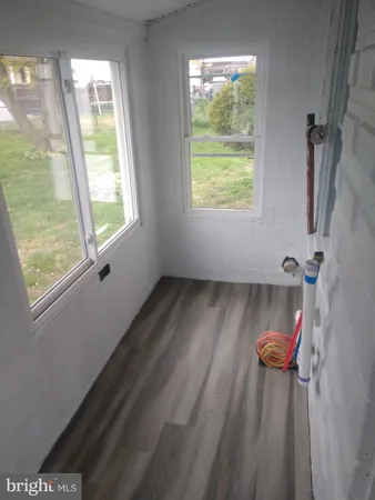 a view of a bathroom with a window and a shower