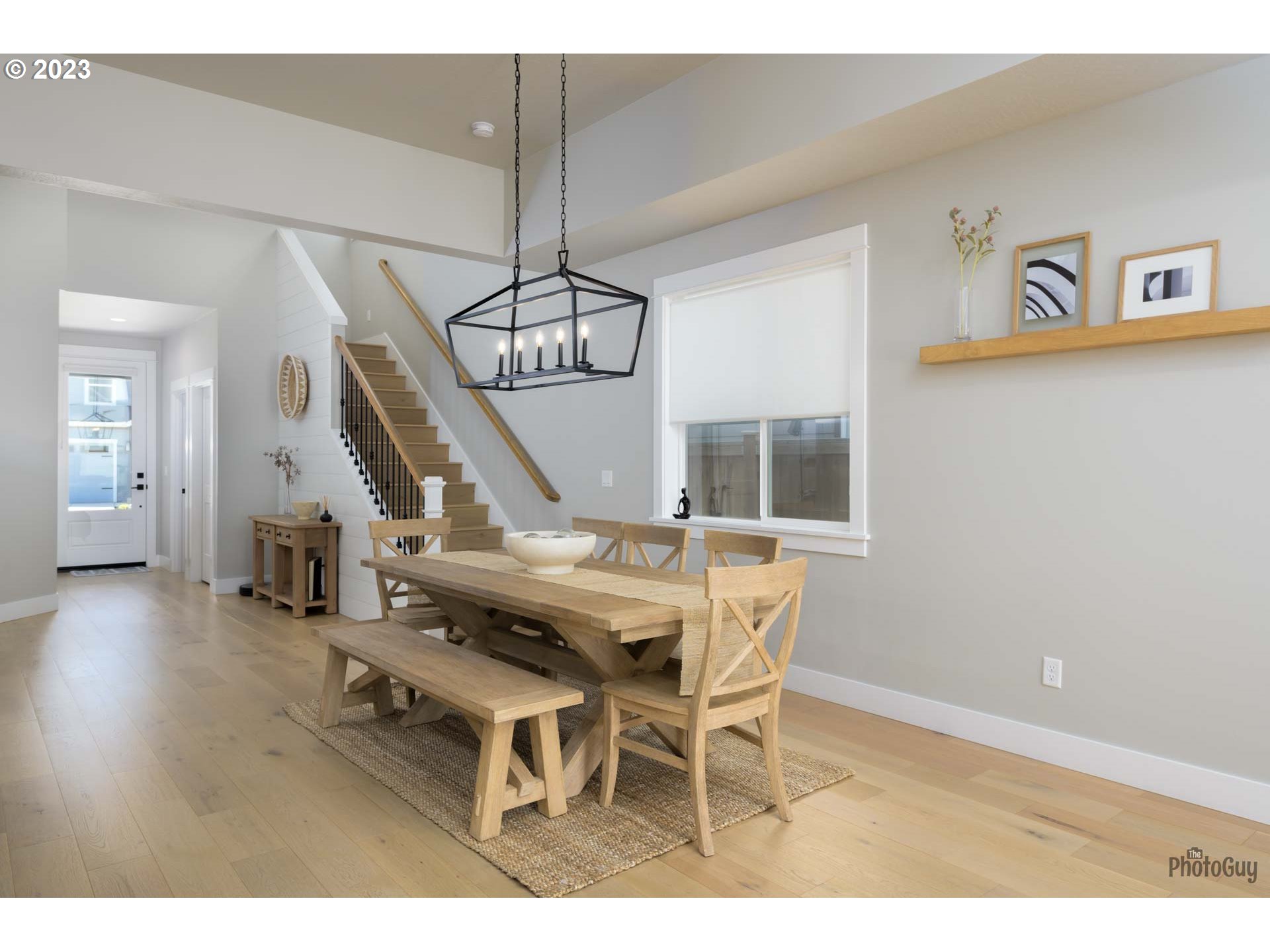 3561 Nestucca Loop Eugene, OR 97408 - Photo 12 of 29 a view of a dining room with furniture wooden floor and chandelier