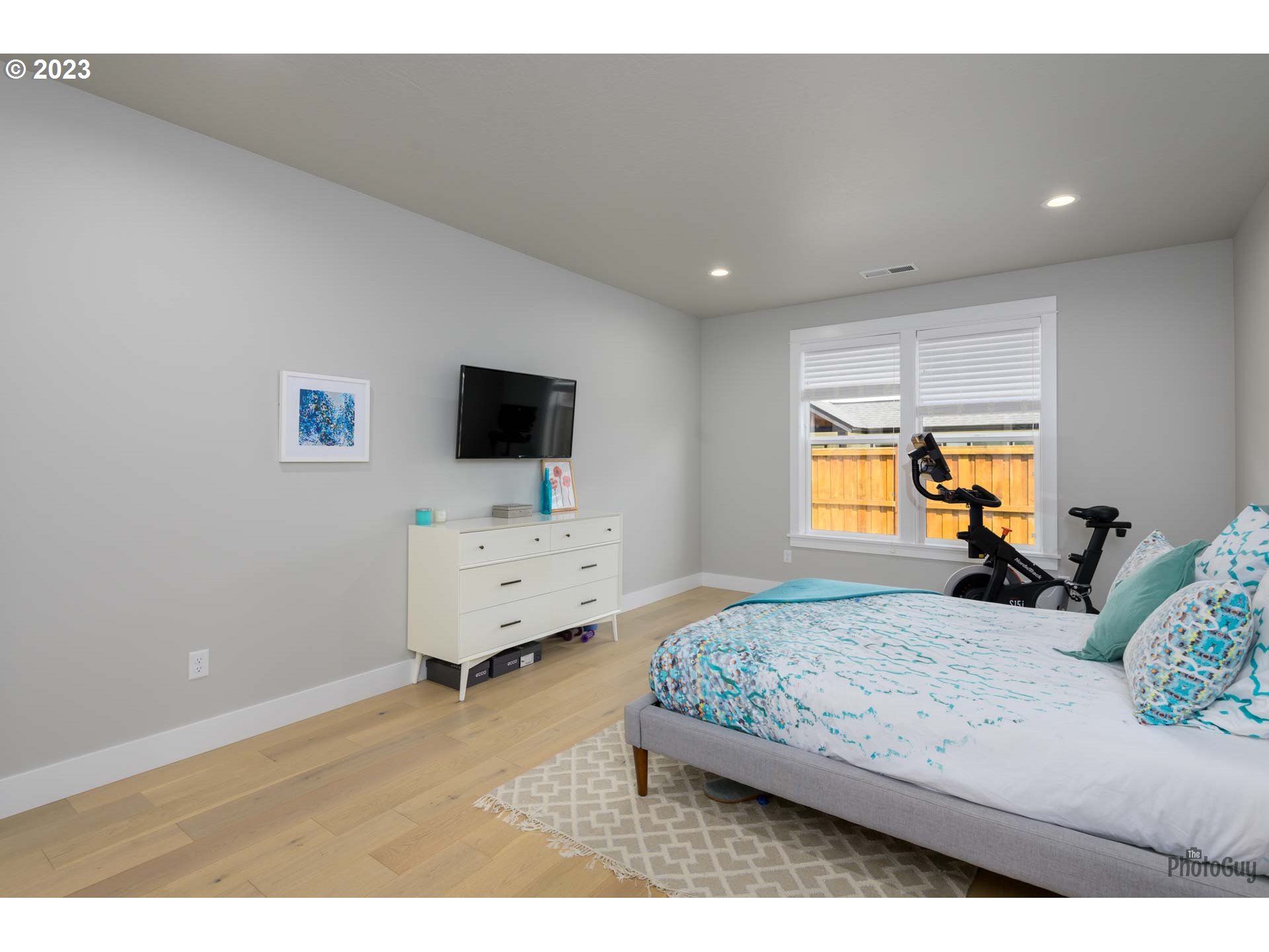 3561 Nestucca Loop Eugene, OR 97408 - Photo 15 of 29 a bedroom with a bed and wooden floor