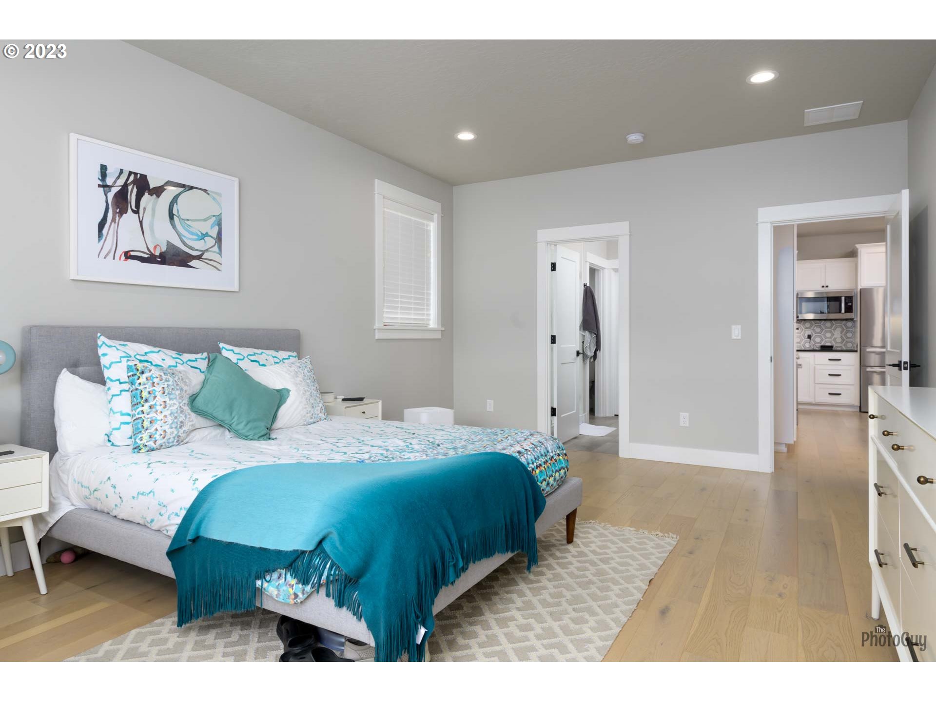 3561 Nestucca Loop Eugene, OR 97408 - Photo 17 of 29 a bedroom with a bed and a chandelier