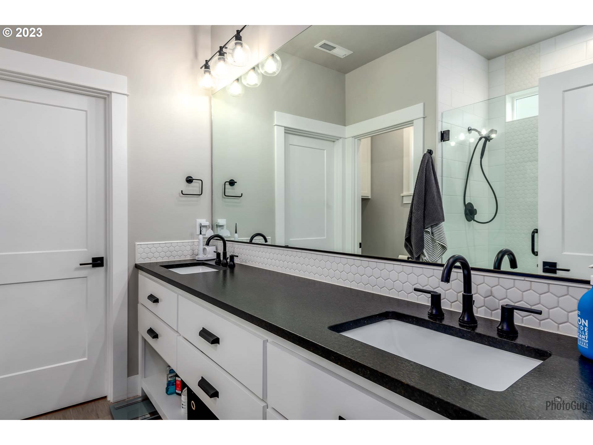 3561 Nestucca Loop Eugene, OR 97408 - Photo 18 of 29 a bathroom with a double vanity sink and a mirror