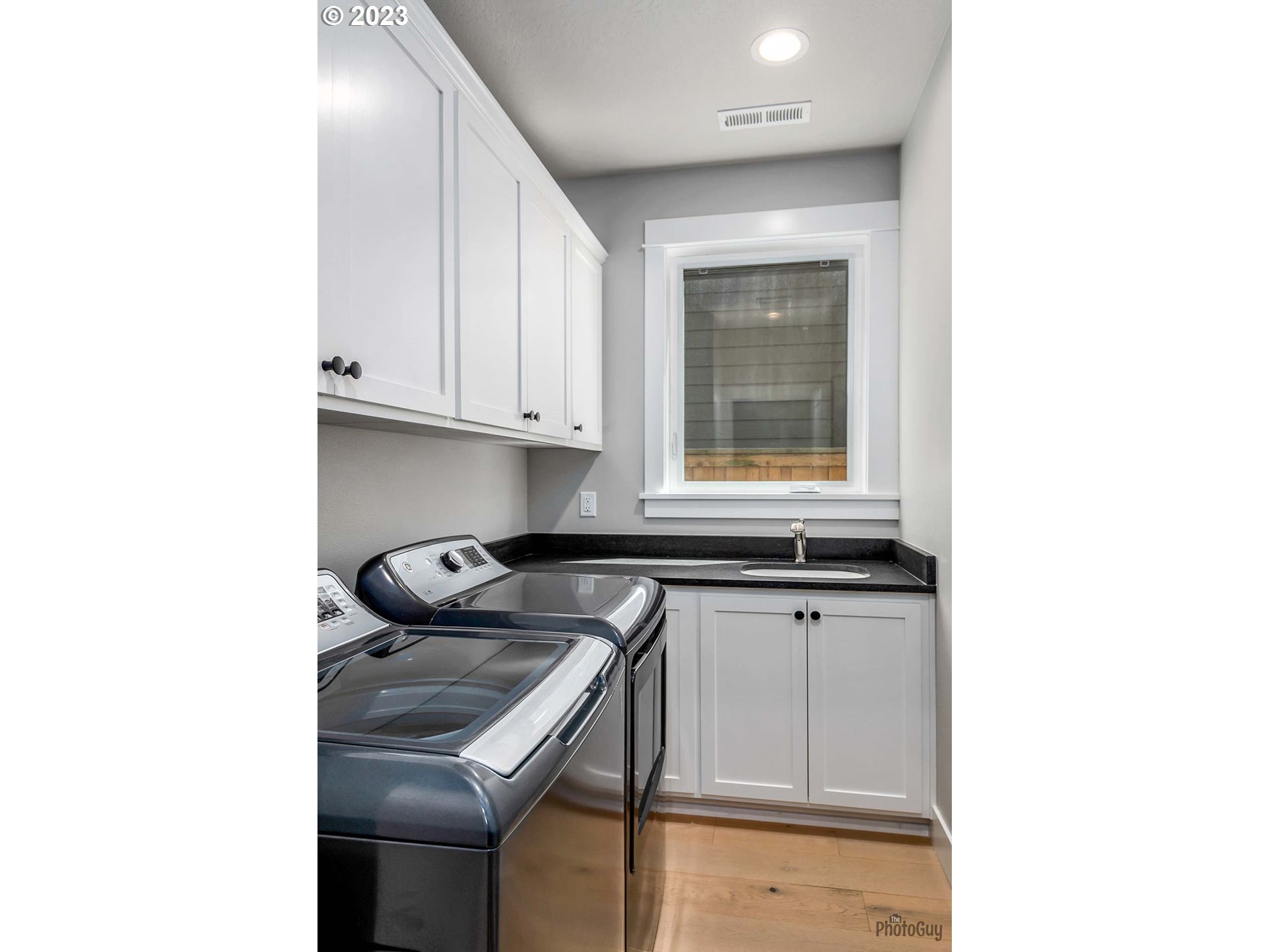 3561 Nestucca Loop Eugene, OR 97408 - Photo 21 of 29 a kitchen with granite countertop a sink and cabinets