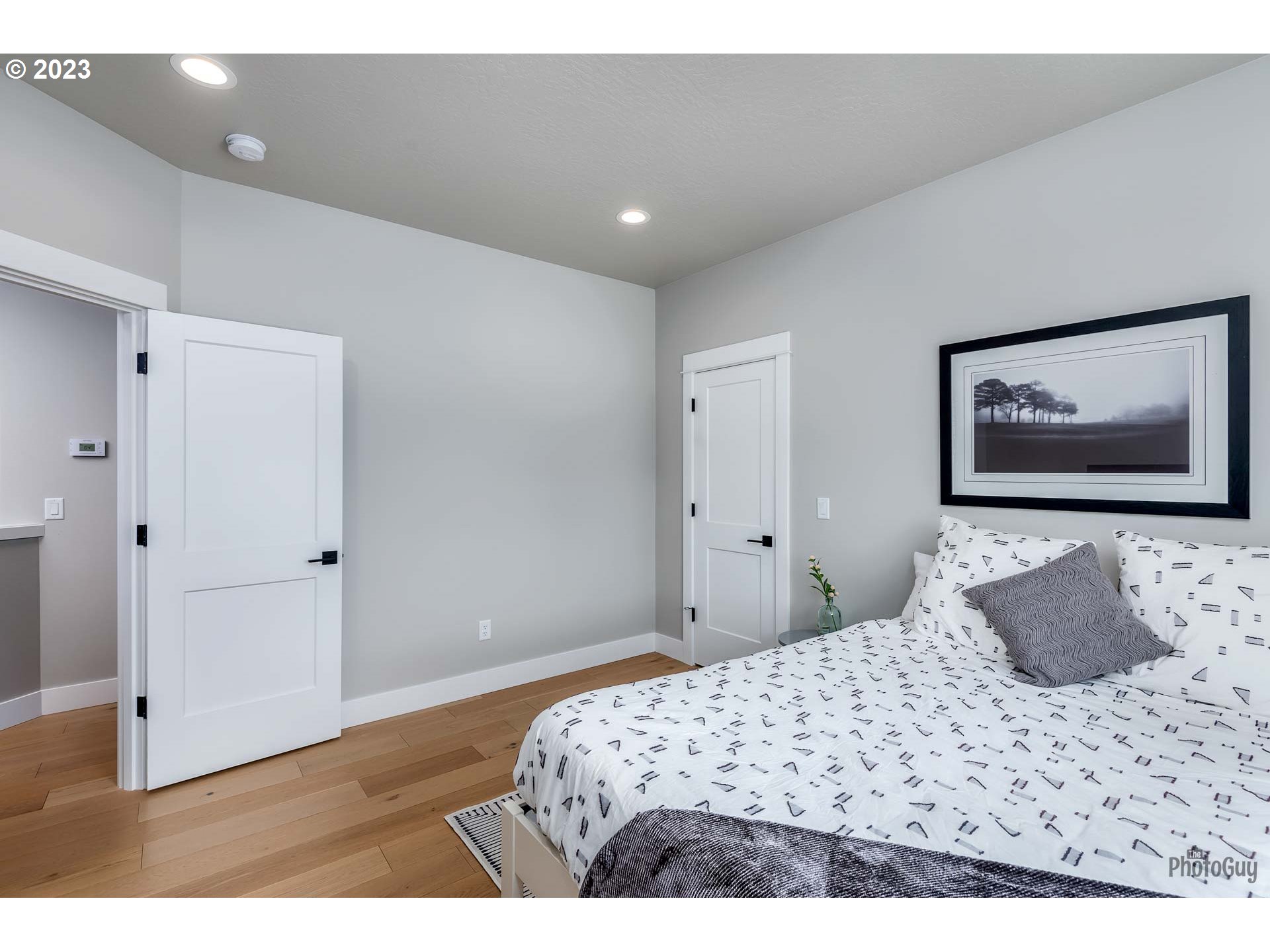 3561 Nestucca Loop Eugene, OR 97408 - Photo 24 of 29 a bedroom with a bed and a painting on the wall