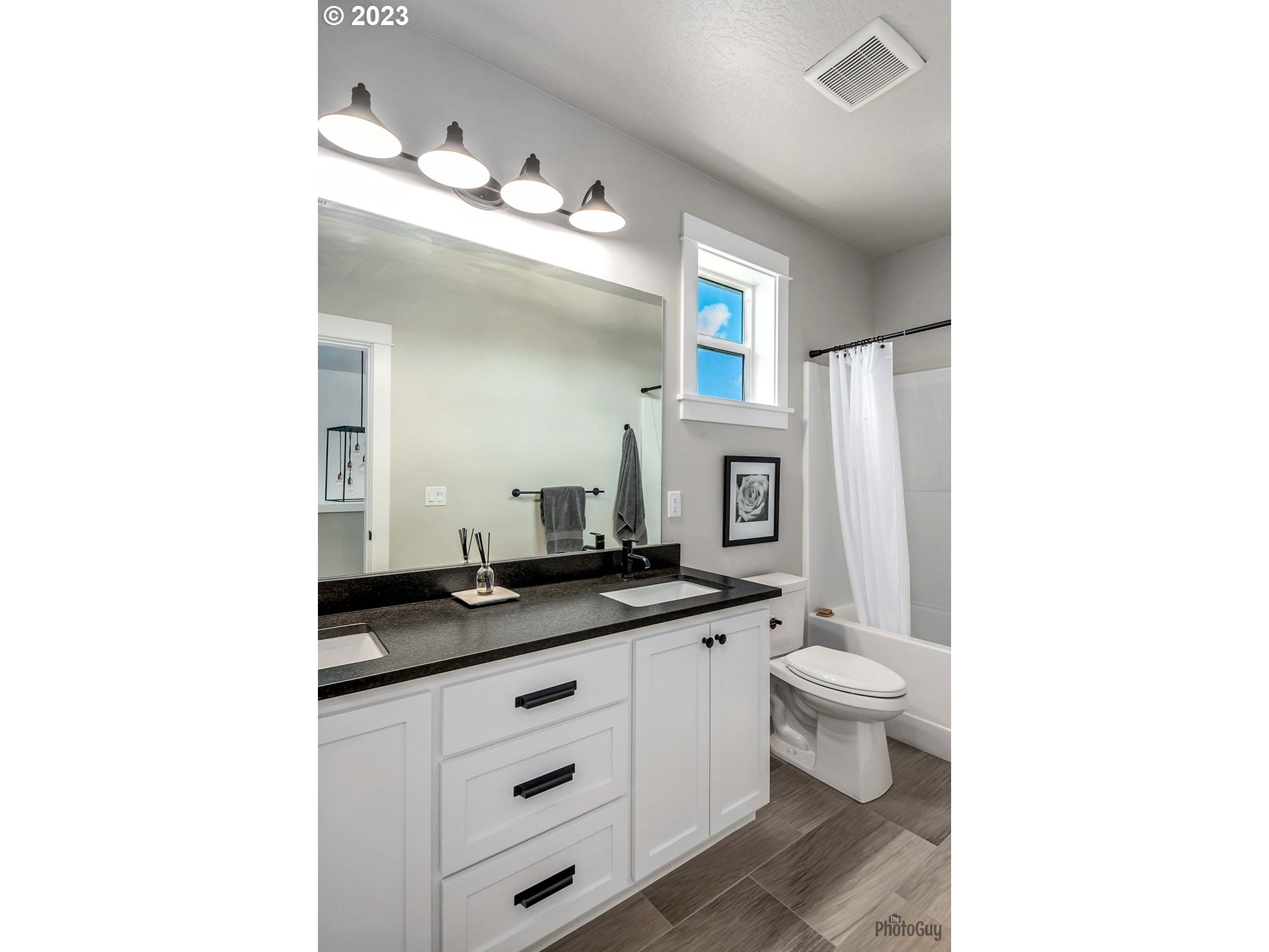 3561 Nestucca Loop Eugene, OR 97408 - Photo 25 of 29 a bathroom with a granite countertop sink a toilet and a mirror