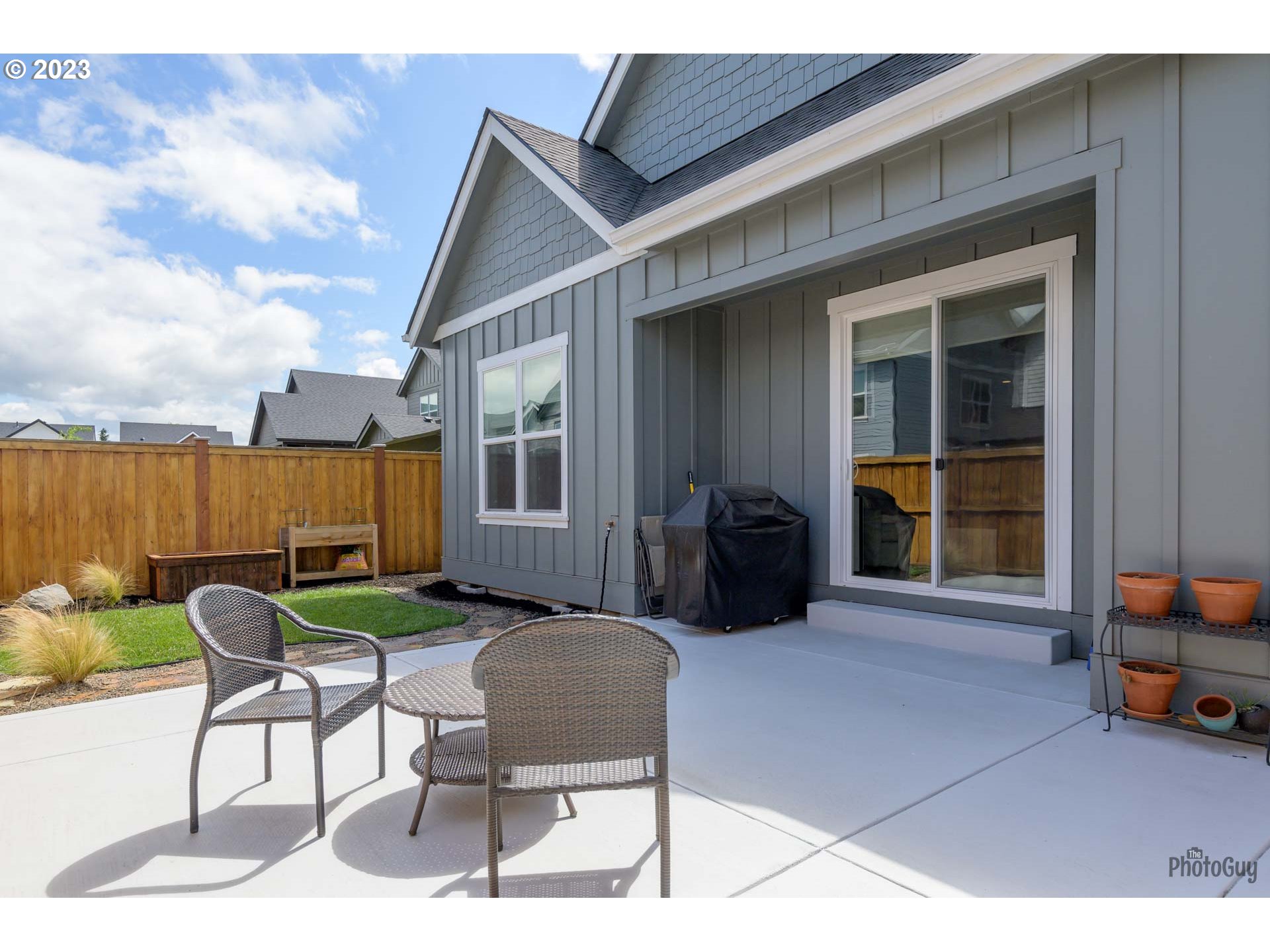 3561 Nestucca Loop Eugene, OR 97408 - Photo 27 of 29 a view of a house with backyard sitting area and furniture