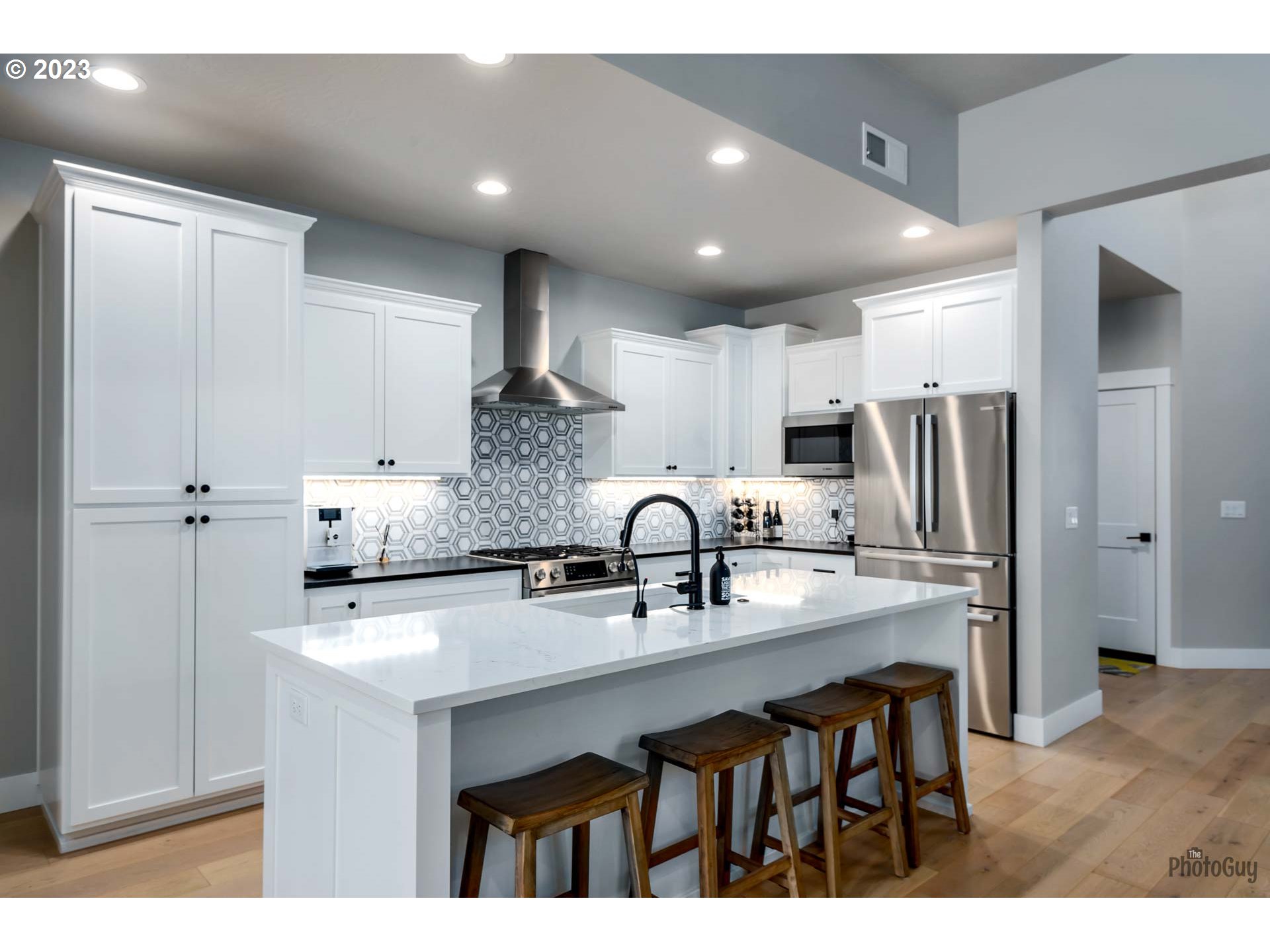 3561 Nestucca Loop Eugene, OR 97408 - Photo 6 of 29 a kitchen with stainless steel appliances granite countertop a sink a stove a refrigerator and cabinets