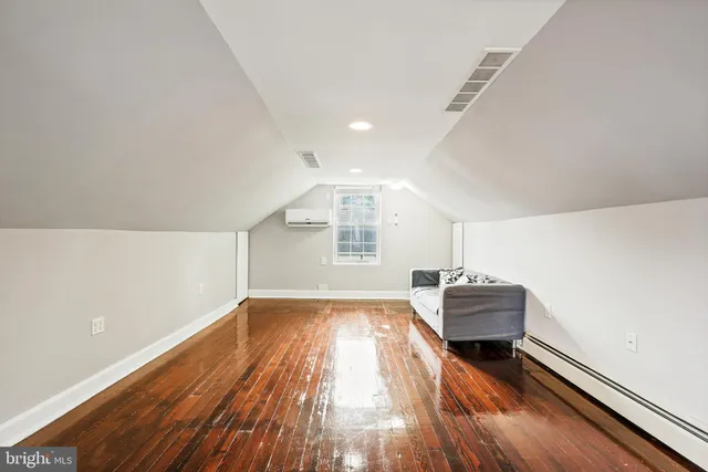 a view of a livingroom with wooden floor