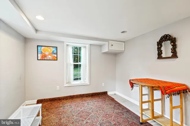a view of room with stairs and windows