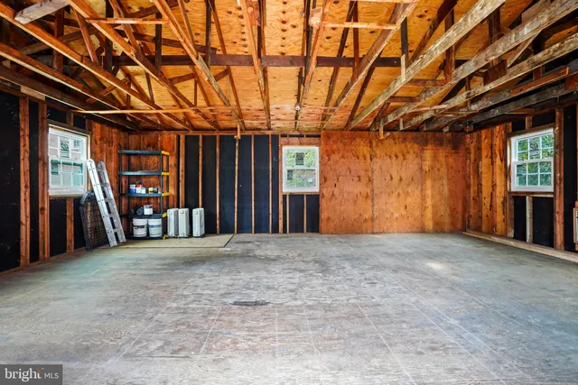 a view of an empty room with a fireplace