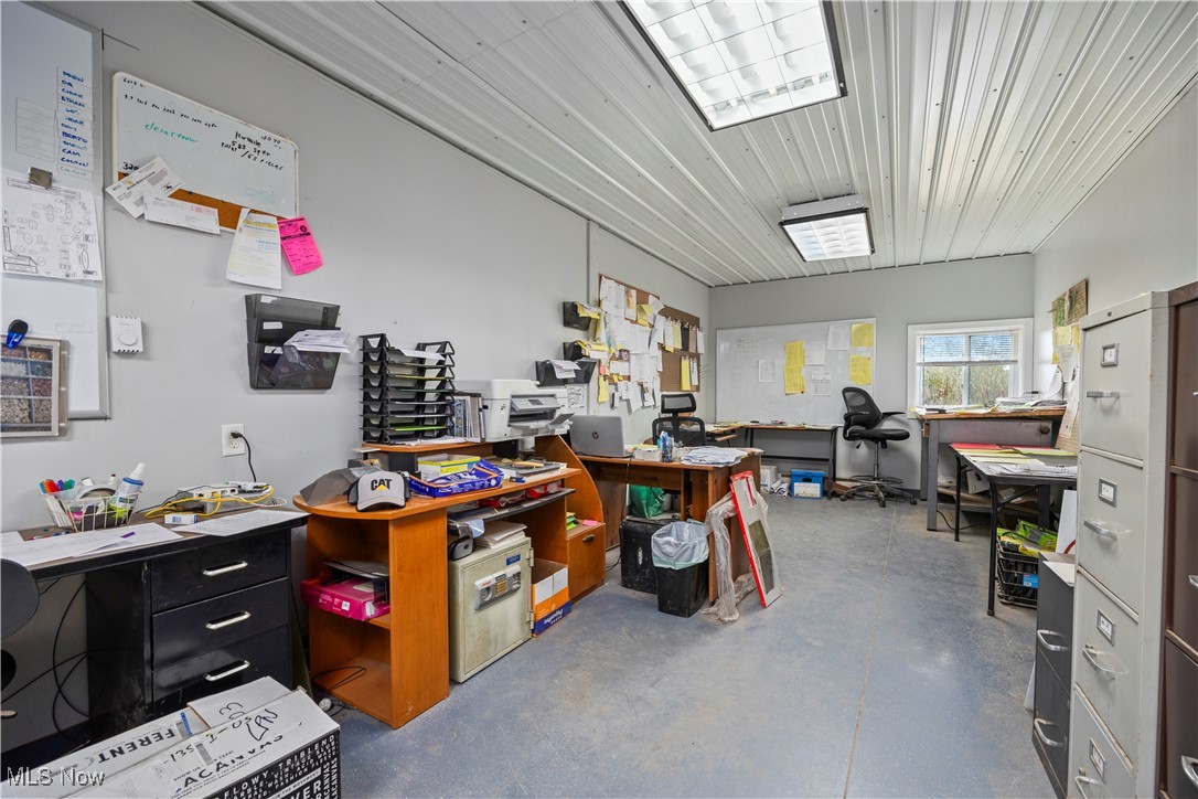 8802 West Mason Road Castalia, OH 44824 - Photo 35 of 49 Misc room featuring a desk and finished concrete flooring