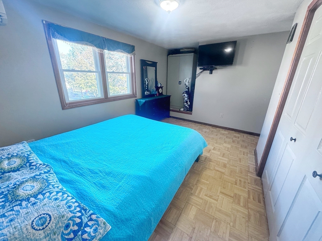 3 Stone Court Gloucester, MA 01930 - Photo 17 of 28 a bedroom with a bed and a window