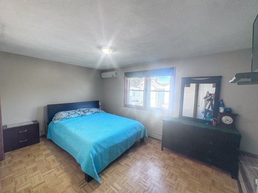 3 Stone Court Gloucester, MA 01930 - Photo 18 of 28 a bedroom with a bed and window