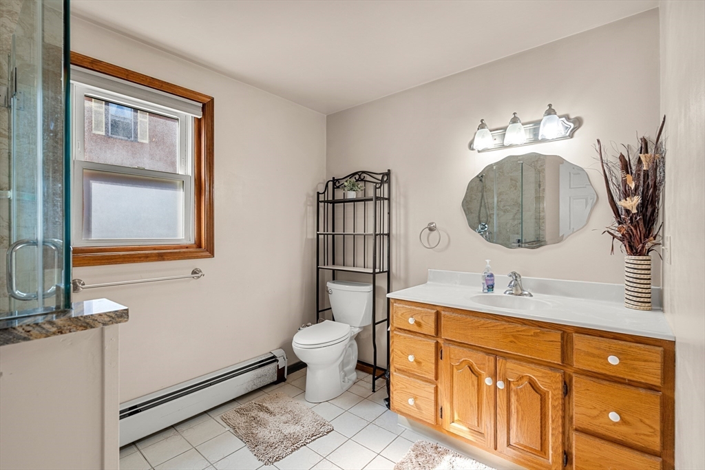 3 Stone Court Gloucester, MA 01930 - Photo 20 of 28 a bathroom with a toilet a sink and mirror