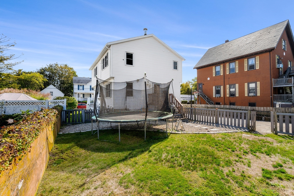 3 Stone Court Gloucester, MA 01930 - Photo 2 of 28 a white house that has a small yard and large trees