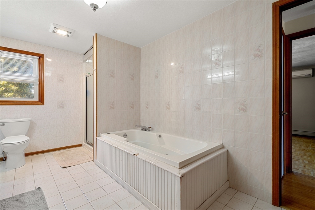3 Stone Court Gloucester, MA 01930 - Photo 21 of 28 a spacious bathroom with a bathtub sink and toilet