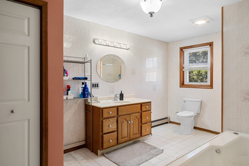 3 Stone Court Gloucester, MA 01930 - Photo 22 of 28 a view of a bathroom sink mirror and toilet