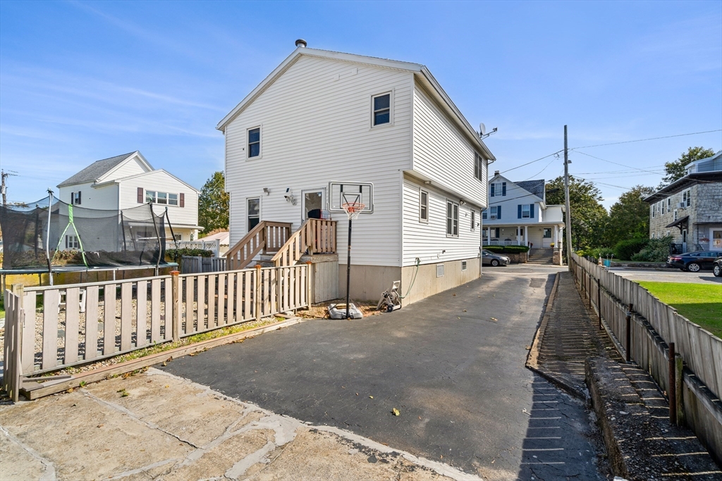 3 Stone Court Gloucester, MA 01930 - Photo 3 of 28 a view of a house with wooden floor roof and wooden fence