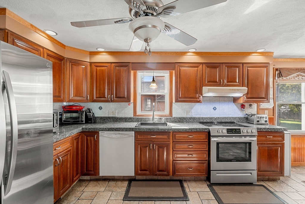 3 Stone Court Gloucester, MA 01930 - Photo 6 of 28 a kitchen with stainless steel appliances granite countertop a stove and a sink