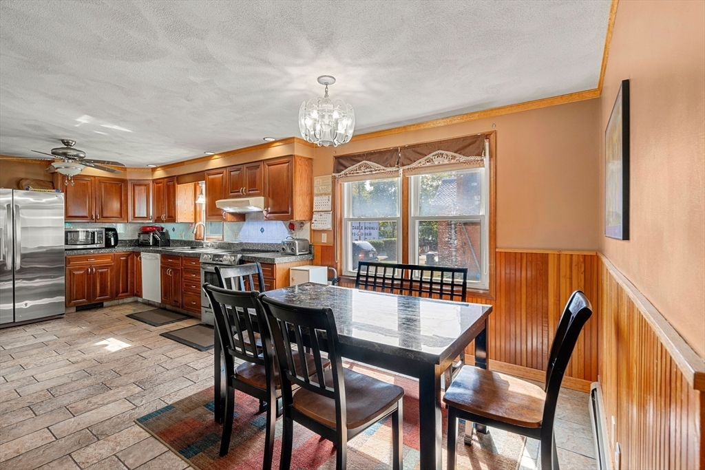 3 Stone Court Gloucester, MA 01930 - Photo 8 of 28 a view of a dining room with furniture window and wooden floor